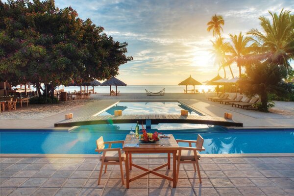 Tropical resort relaxing by the pool