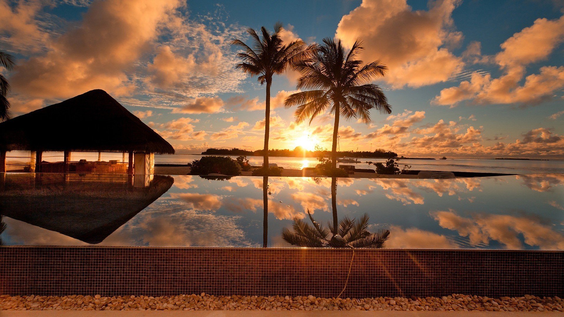 atardecer y amanecer atardecer playa sol océano amanecer cielo agua palmas arena mar mar paisaje viajes tropical naturaleza isla verano paisaje paraíso crepúsculo