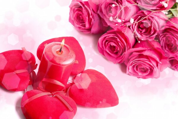 Pink candle surrounded by hearts. pink roses