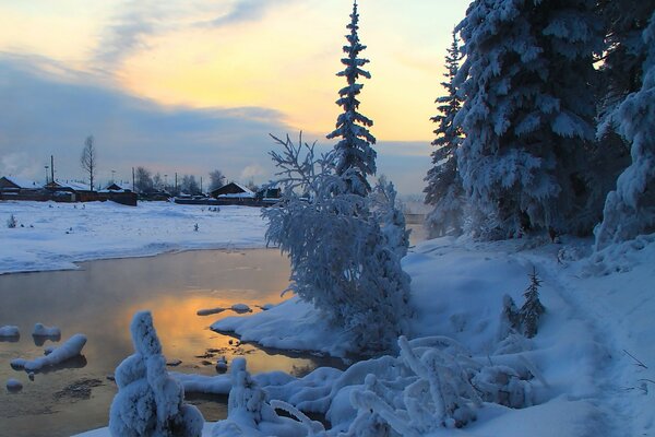 Winter river on the outskirts of the village