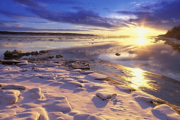 Fabulous sunset on the bank of a stream