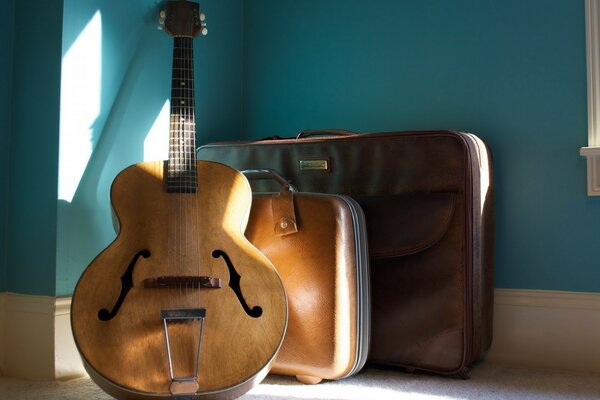 Guitar against the wall in the room