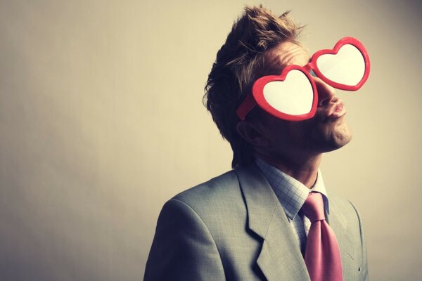 Portrait of a man with heart glasses