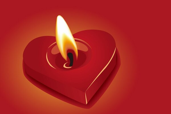 Burning red candle in the shape of a heart