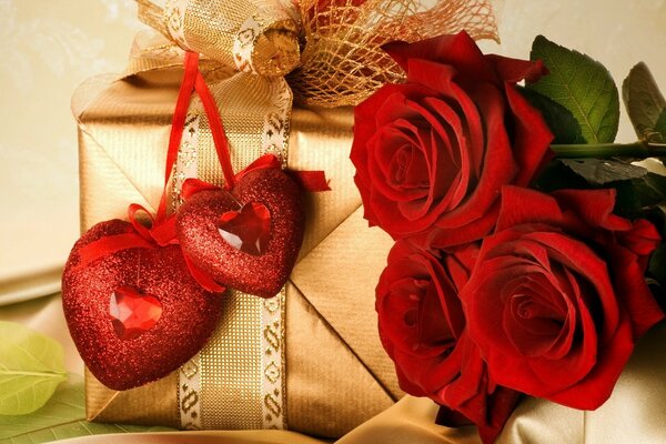 Beau cadeau avec des coeurs et des fleurs rouges