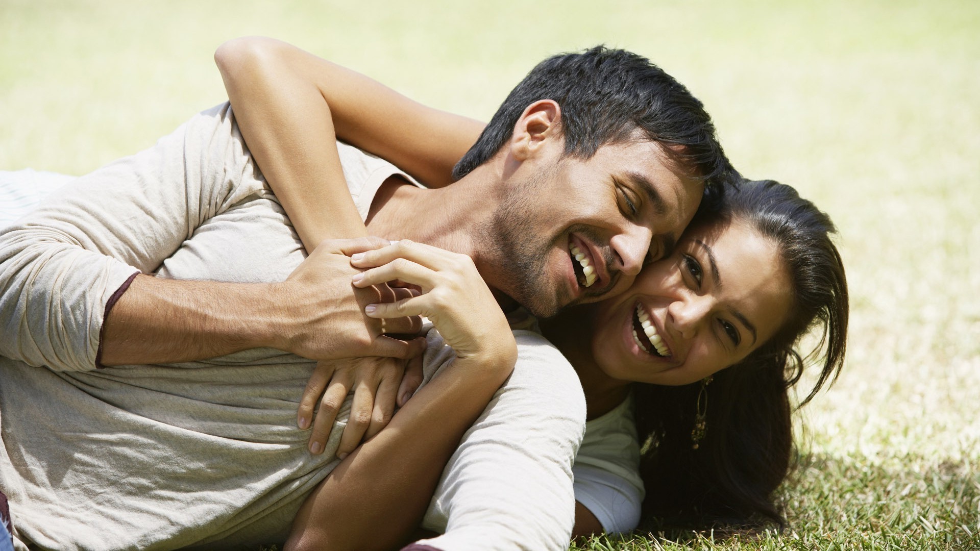 couples woman relaxation outdoors leisure togetherness affection love man reclining facial expression embrace adult happiness enjoyment two daylight romance