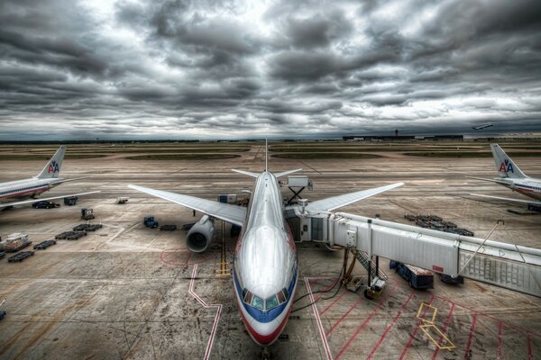 A large plane at the airport against the background of the Swentz sky