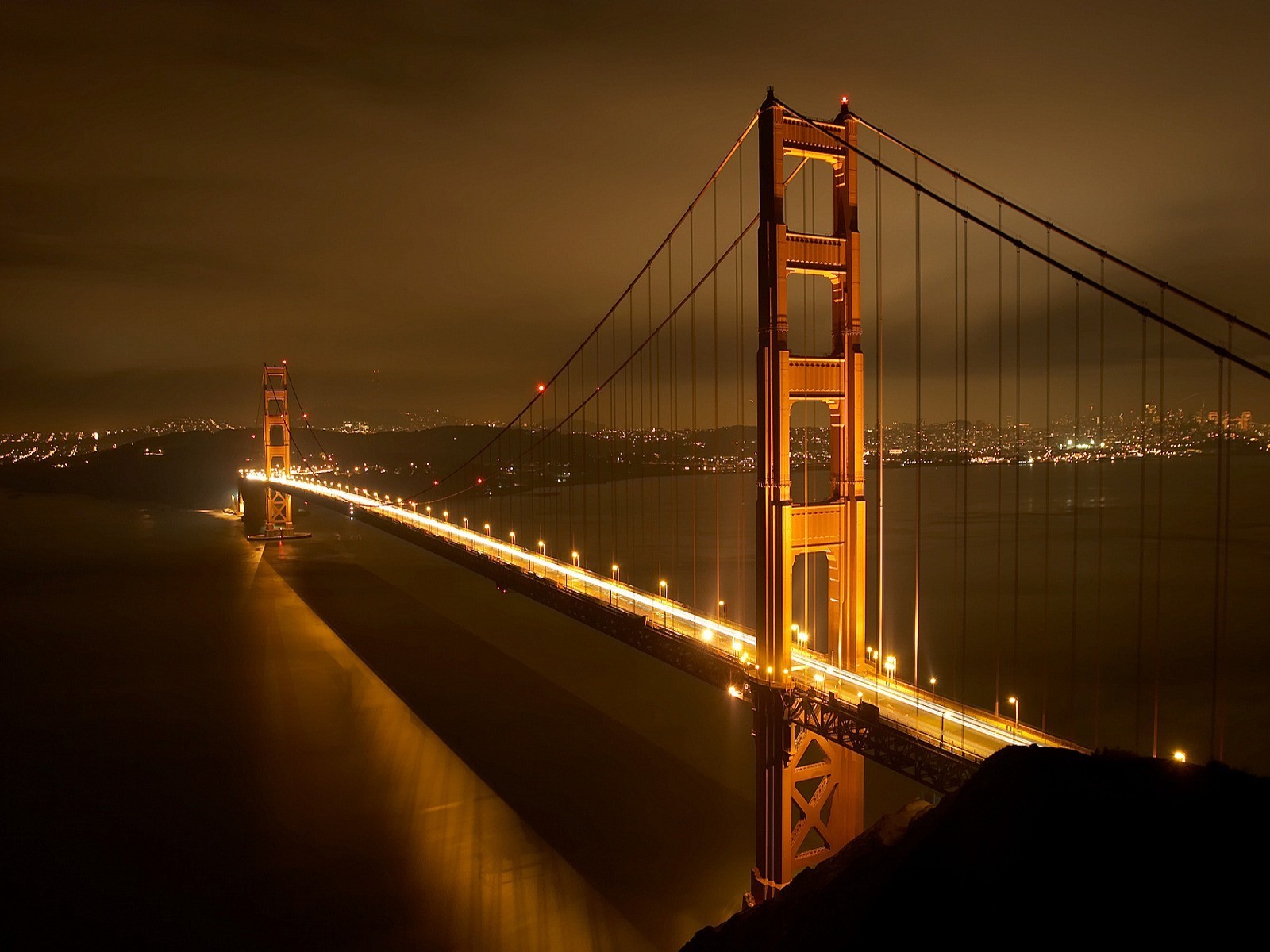 bridges bridge sunset city dusk architecture evening water river urban downtown suspension bridge transportation system sky traffic light travel building reflection dawn street