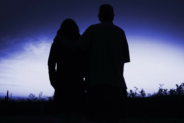 A couple in love on a blue background together