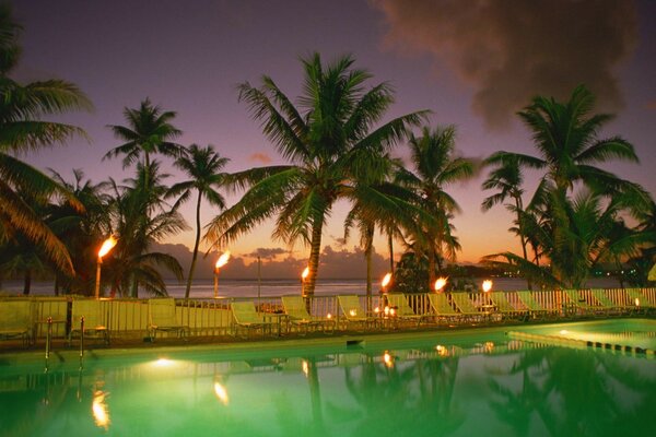 Reflection of evening lights in a pool with water