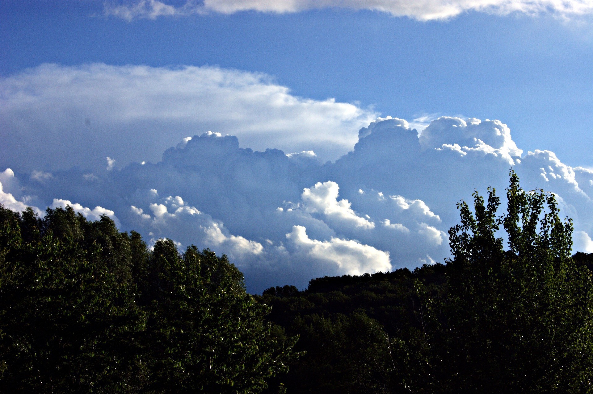 the sky sky landscape nature mountain outdoors travel tree fog sun daylight sunset light fair weather wood cloud dawn summer