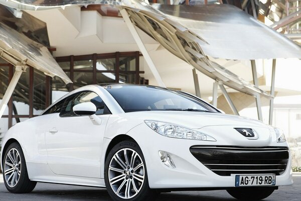 Luxury white Peugeot on the road