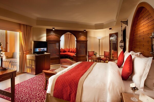 Bedroom with a large bed and red pillows