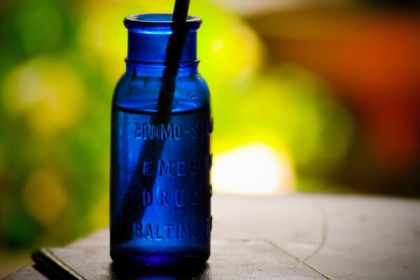 A blue jar on a blurry background