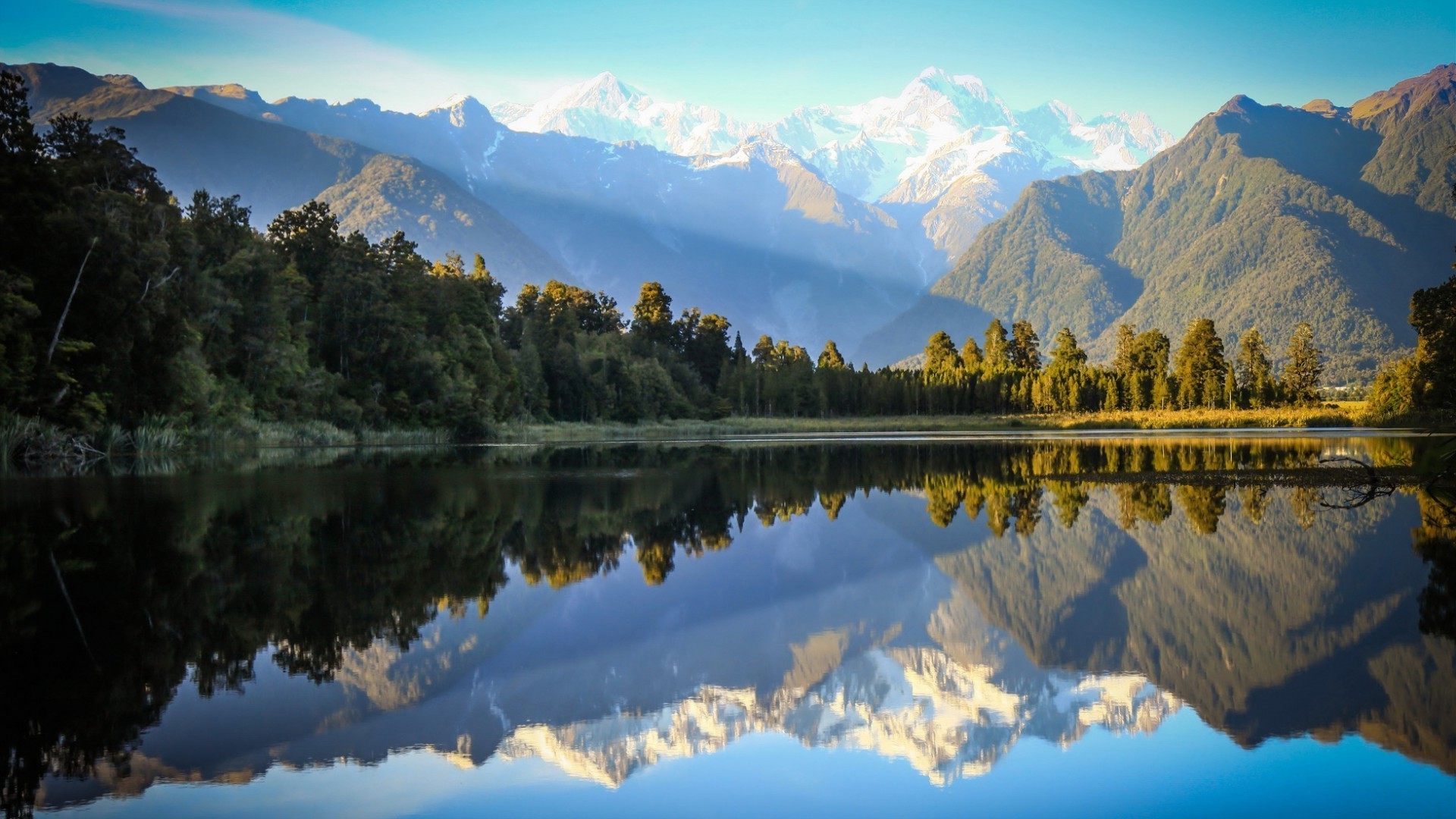 lake reflection mountain water landscape snow scenic nature wood dawn travel outdoors sky tree sunset valley river