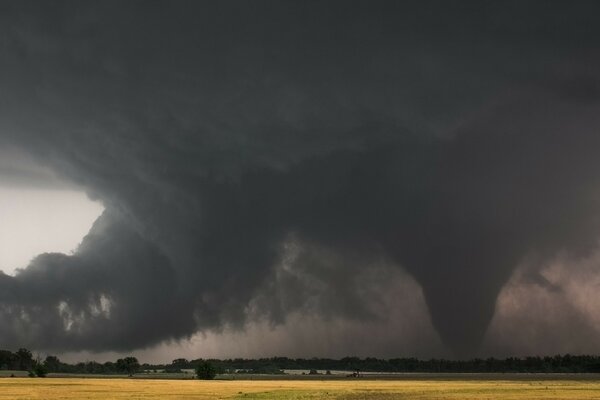 The funnel of a hurricane against the dark sky