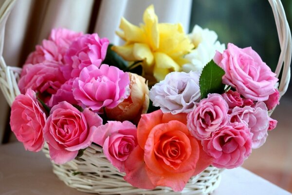 Bouquet of roses in a wicker basket