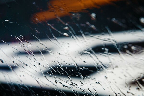 Macro photography of falling water on glass