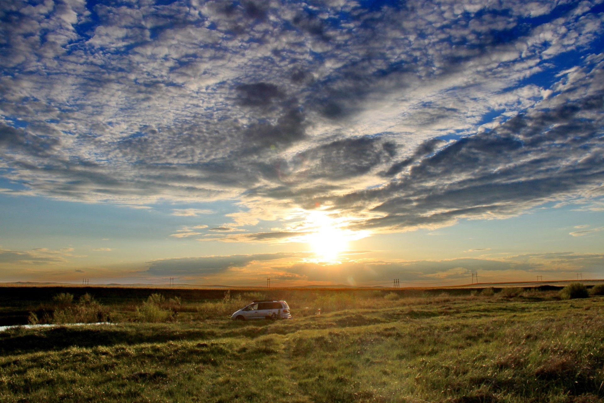 the sunlight and rays sunset landscape sky dawn sun dusk evening nature storm outdoors fair weather travel daylight light grass