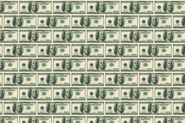 Wallpaper with hundred dollar bills in large quantities