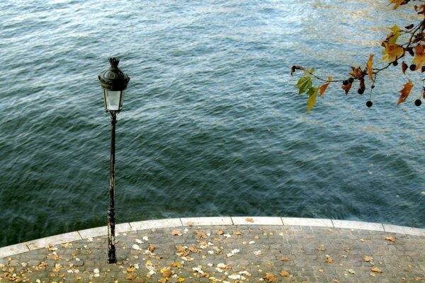 Photo of a lantern on the background of water