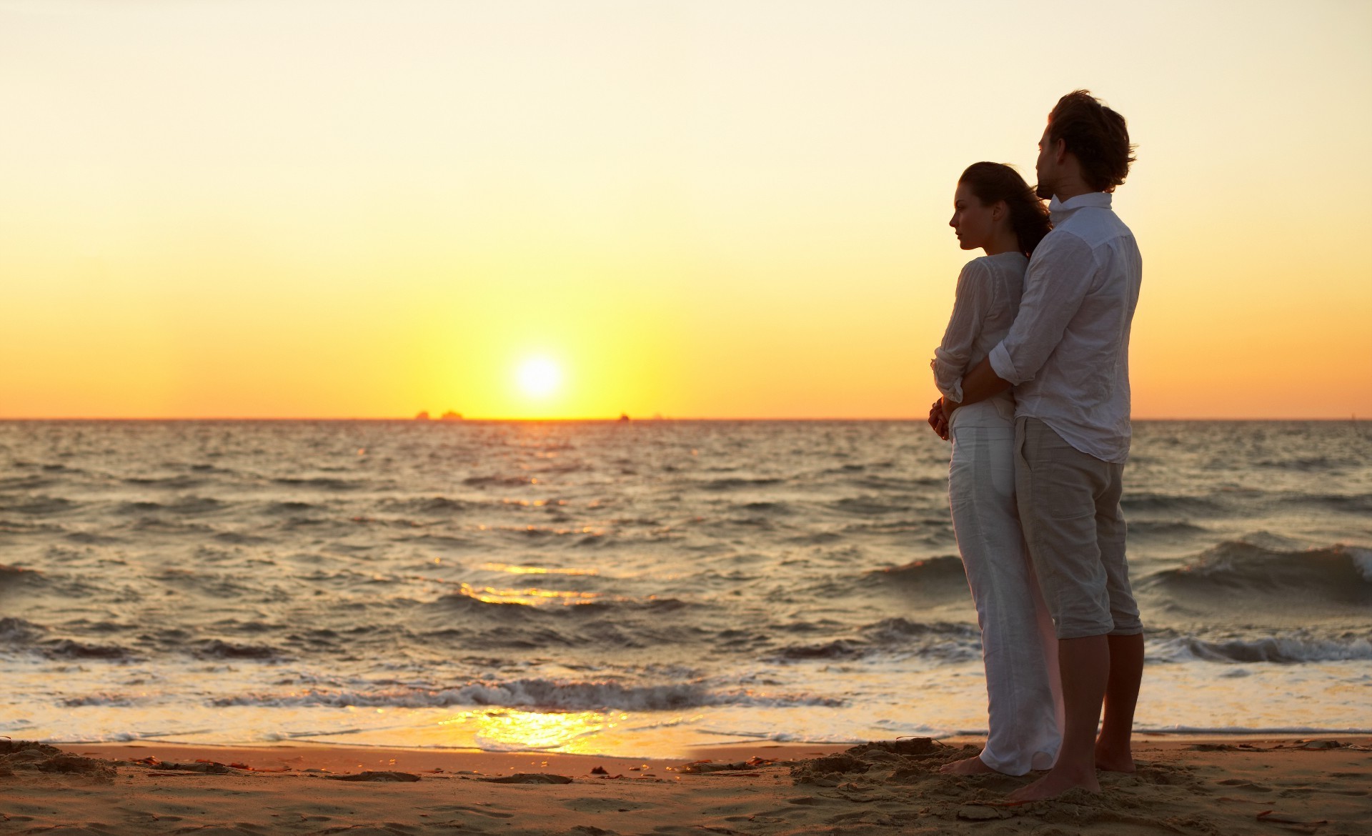 couples sunset water sun beach sea romance dawn ocean summer sand dusk relaxation fair weather