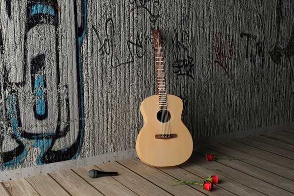 A lone guitar near a graffiti wall