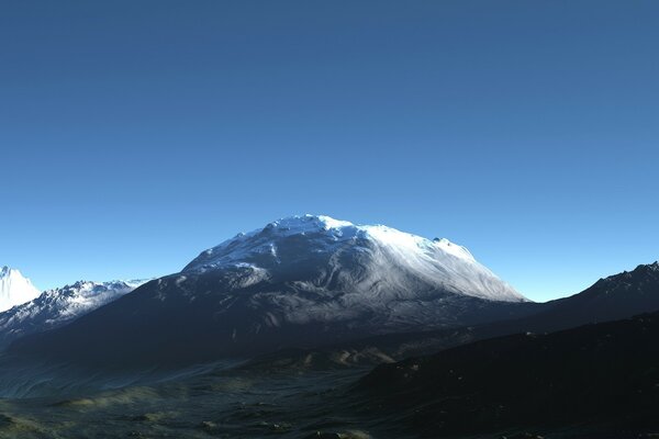 Landscape with snow-covered mountain and blue sky