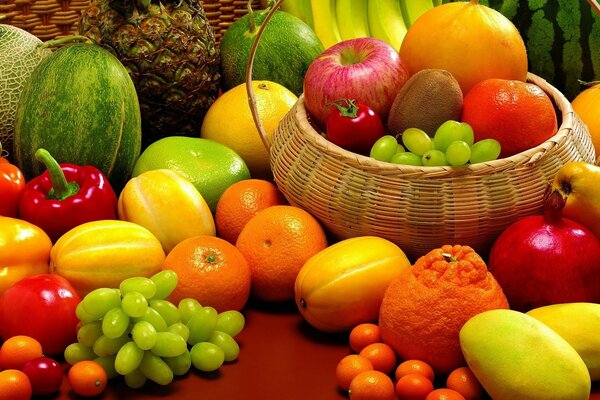 Fruit basket with grapes orange and tangerines