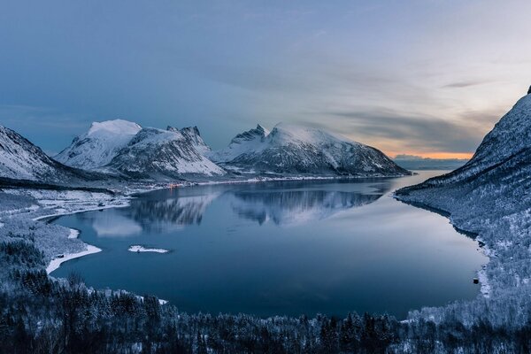 The clear lake is surrounded by mountains