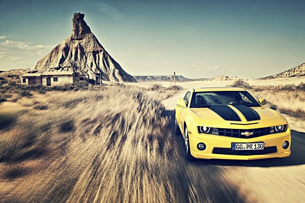 Yellow car at speed