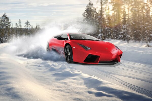 Red car on the background of a winter forest