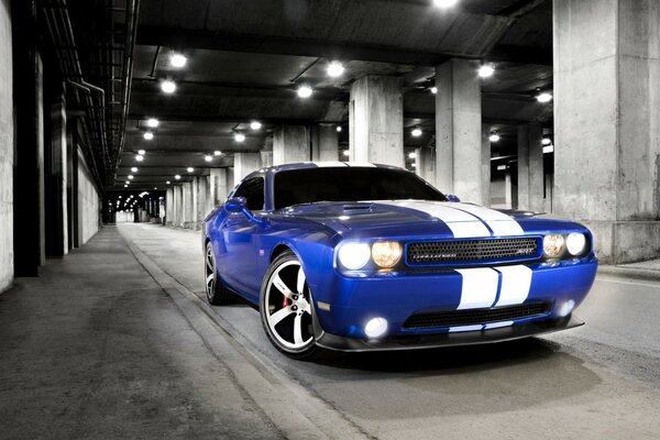 A bright sports car on a black-and-white background