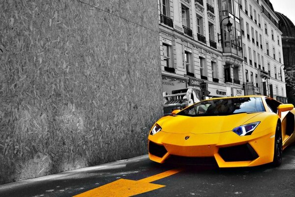 Yellow sports car on a city street