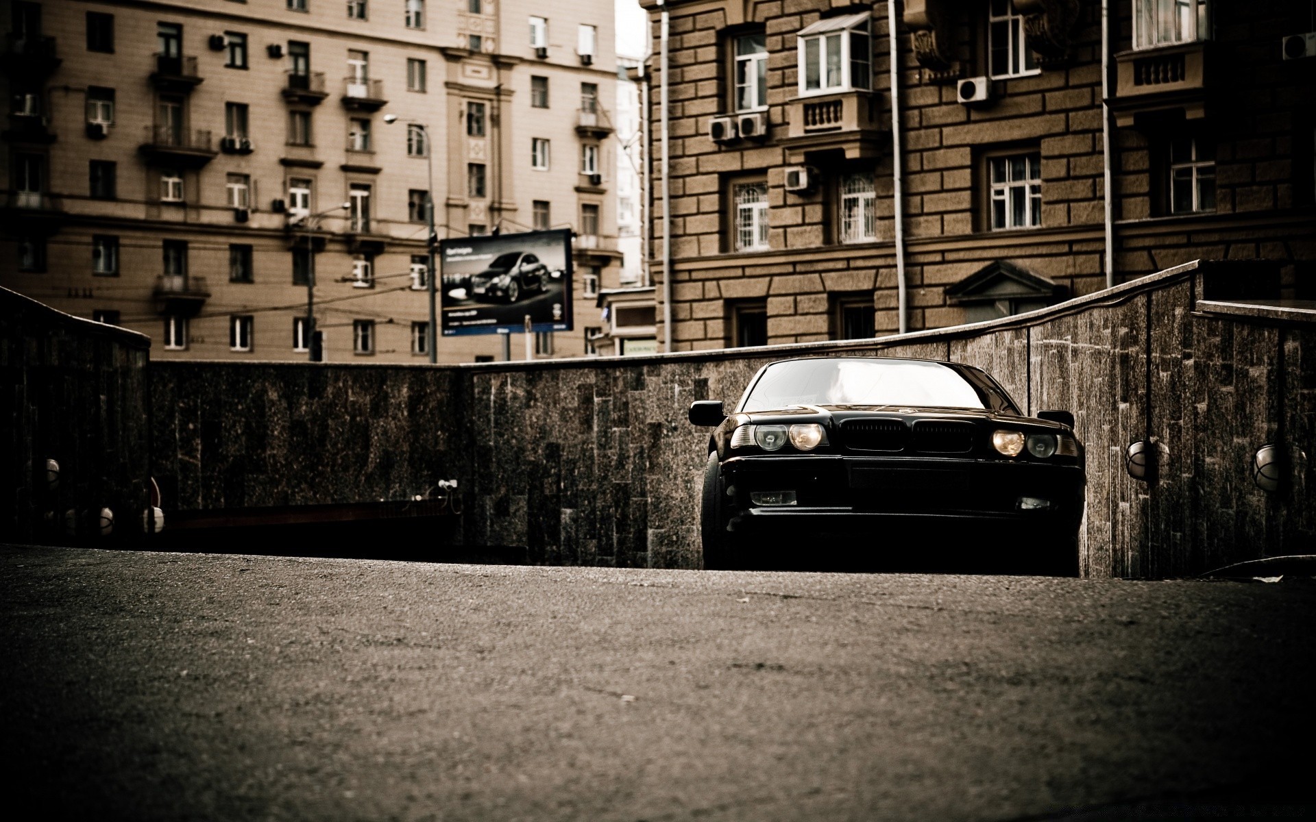 cars street monochrome city urban car road old dark pavement abandoned shadow light building offense