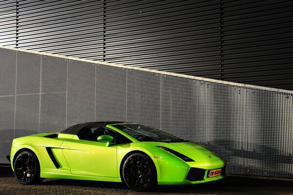 Bright neon car on a gray background