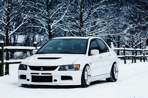 Winter photo of a white car