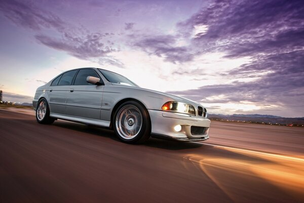 A car on the background of a beautiful sunset