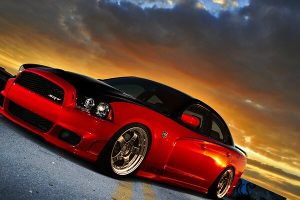 Red sports car at sunset