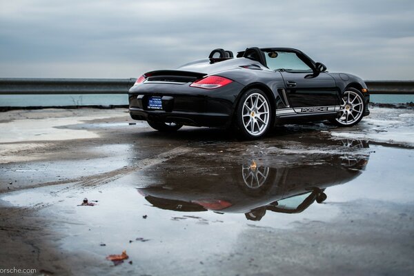 Car on the beach after the rain