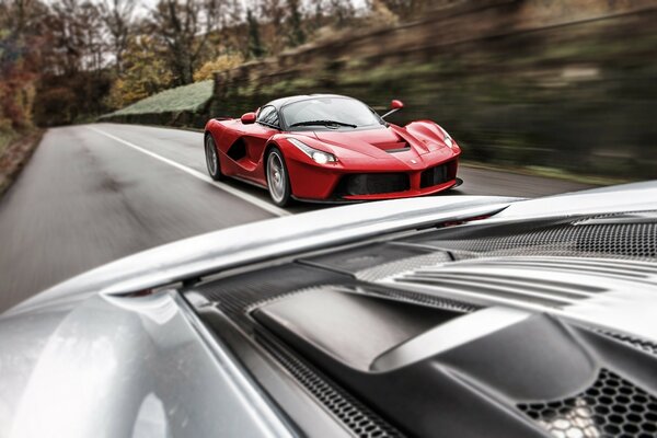 Red and grey car race