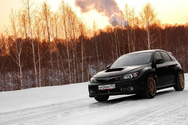 A black car on an icy road