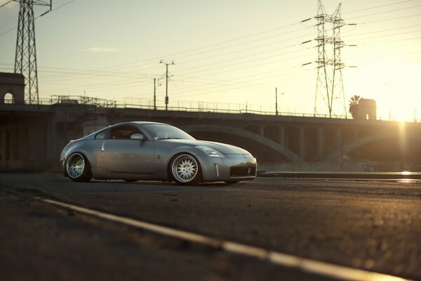 A car with a bridge in the background