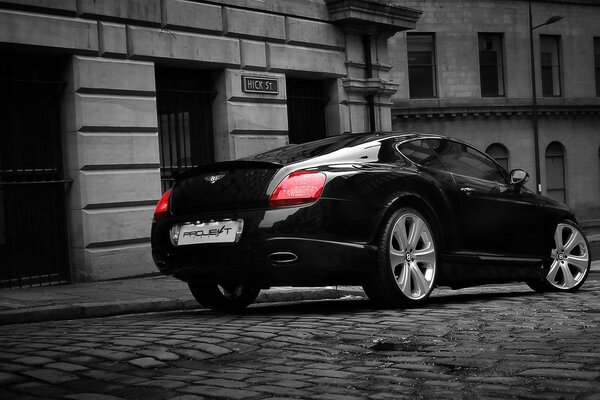 Sidewalk street, combined with a black car