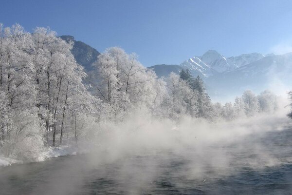 Fog over a winter mountain river