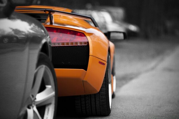 Orange racing car on the road