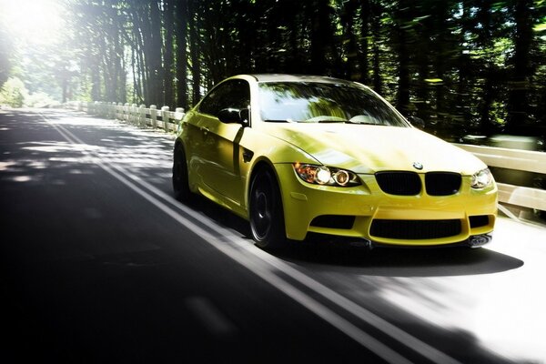 BMW M3 dakar yellow sedan car yellow on the highway