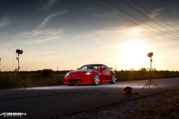 Luxury car on the road during sunset