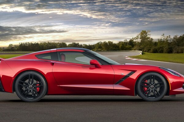 Beautiful red car on a clear day background