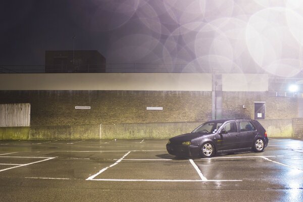 Amateur photo of an old car in the parking lot